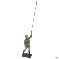 Lineol Signals soldier standing, laying cable
