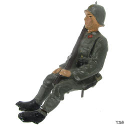Lineol Gunner sitting, with rifle